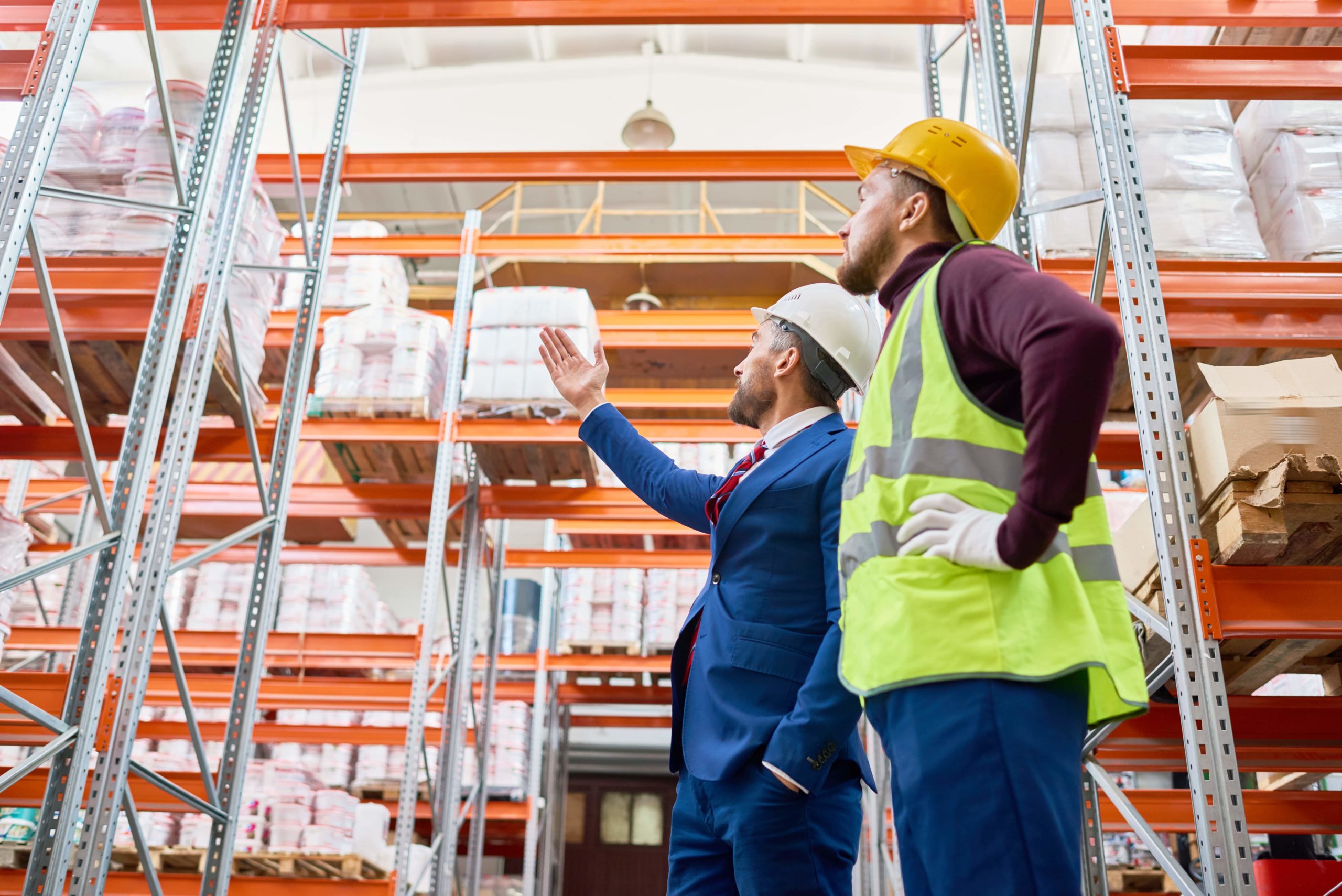 senior businessman doing inventory in warehouse